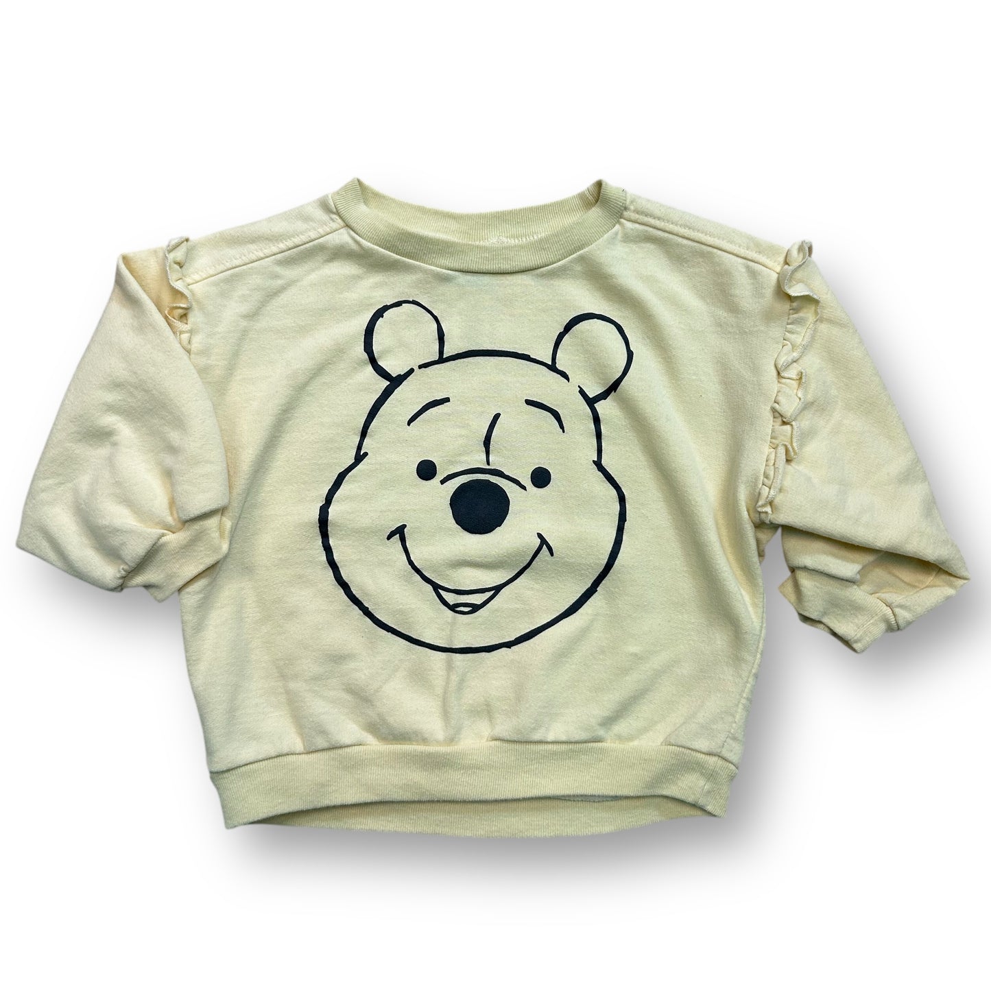 A yellow girls' sweatshirt with a Winnie the Pooh character design on the front.