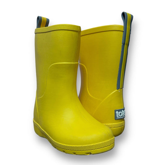 A pair of yellow Totes brand rain boots for toddlers.