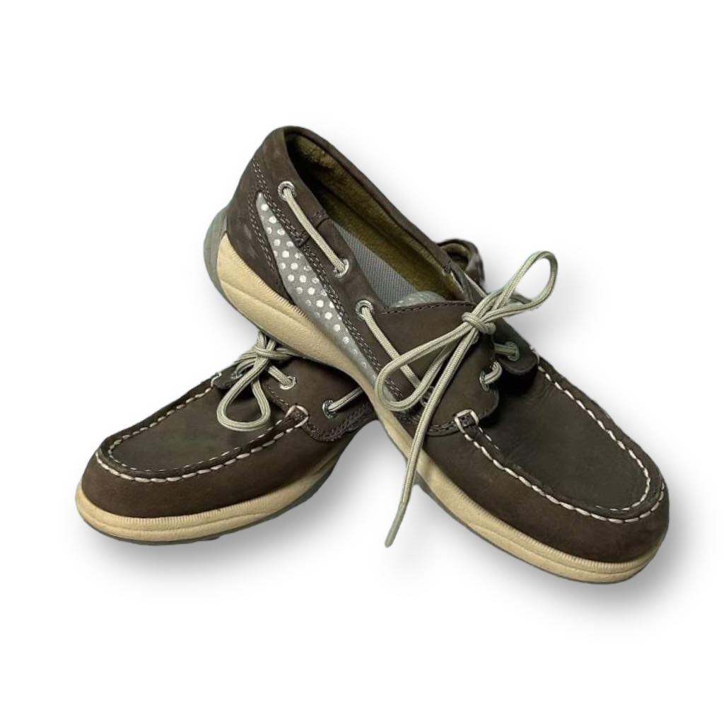 A pair of Sperry Top-Sider women's size 6 gray comfort fit classic boat shoes with lace-up closure.
