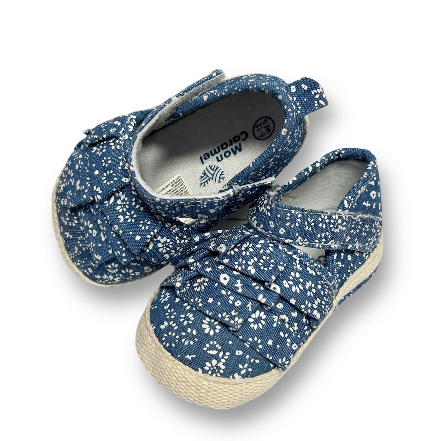 A pair of blue ruffle easy-on shoes for baby girls, with the brand name 'Mon Caramel' visible on the top.