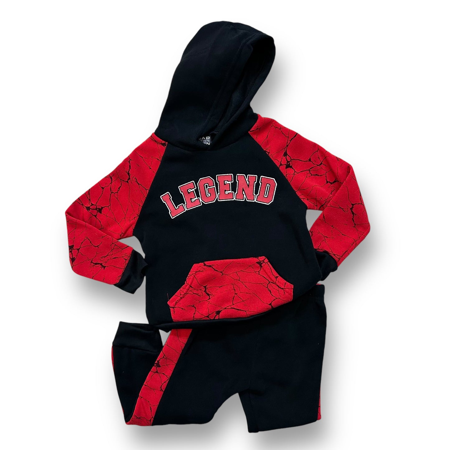A black and red hoodie with 'LEGEND' written in red on the front, paired with black sweatpants with a red pattern on the leg.