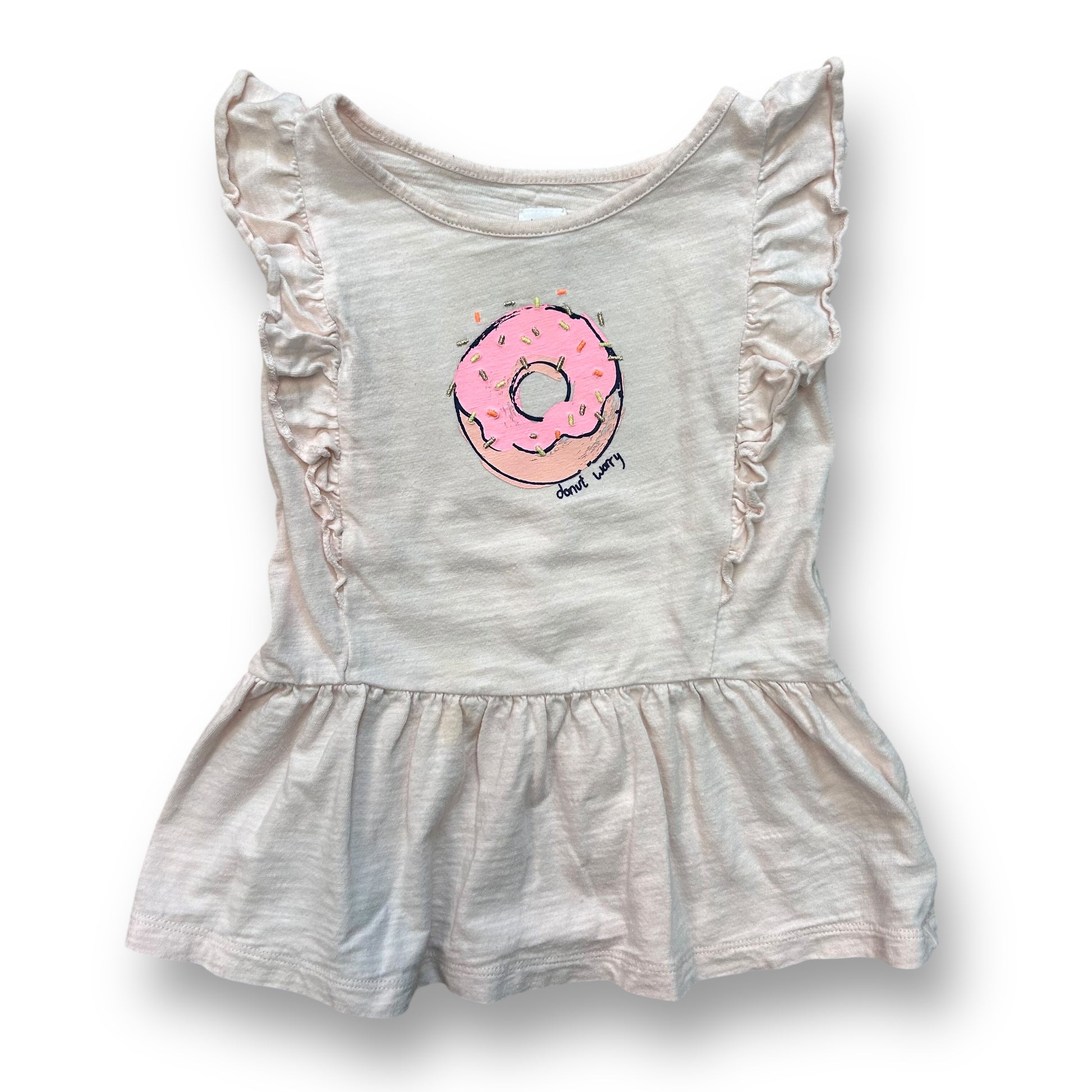 A pale pink girls' dress with a donut design on the front and ruffled sleeves and skirt.