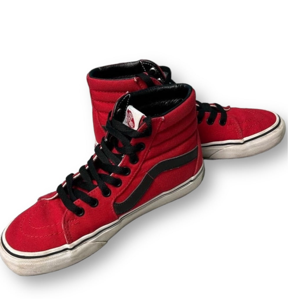 Red high-top sneakers with black accents on a white background
