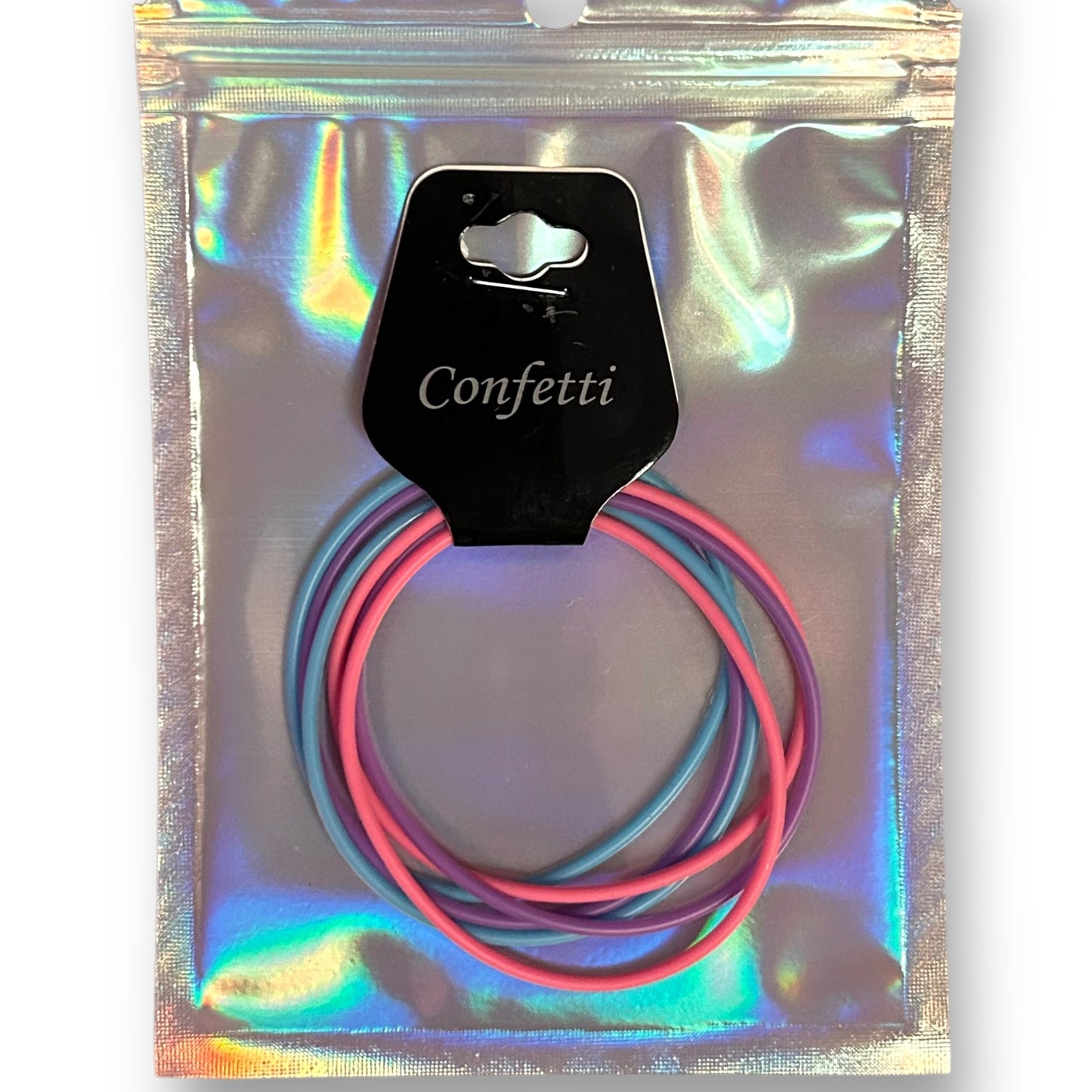 A pack of three gummy bracelets in pink, purple, and blue colors, visible through the transparent packaging with a label that reads 'CONFETTI'.
