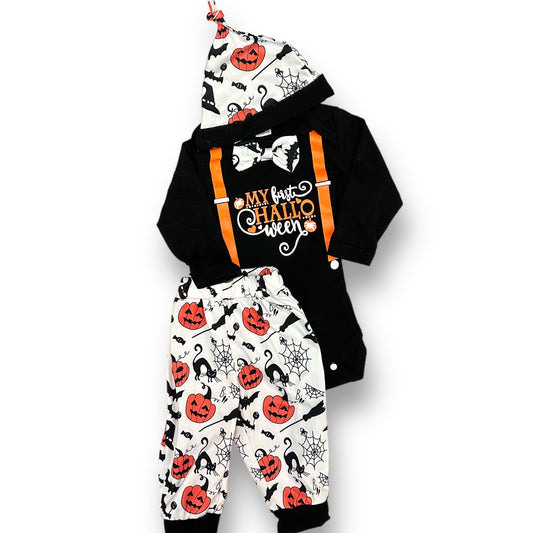 A Halloween-themed outfit for a baby boy, featuring a black bodysuit with white and orange patterned bottoms and a black beanie with 'MY FIRST HALLOWEEN' text on it.