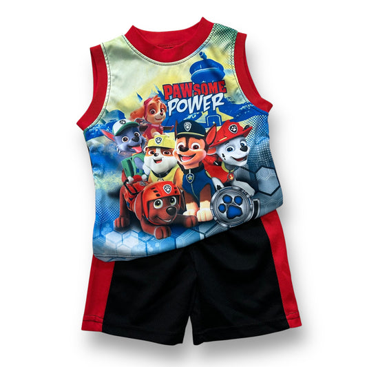 A boys' Nickelodeon Paw Patrol outfit featuring a tank top with Paw Patrol characters and a red pair of shorts with the same characters.