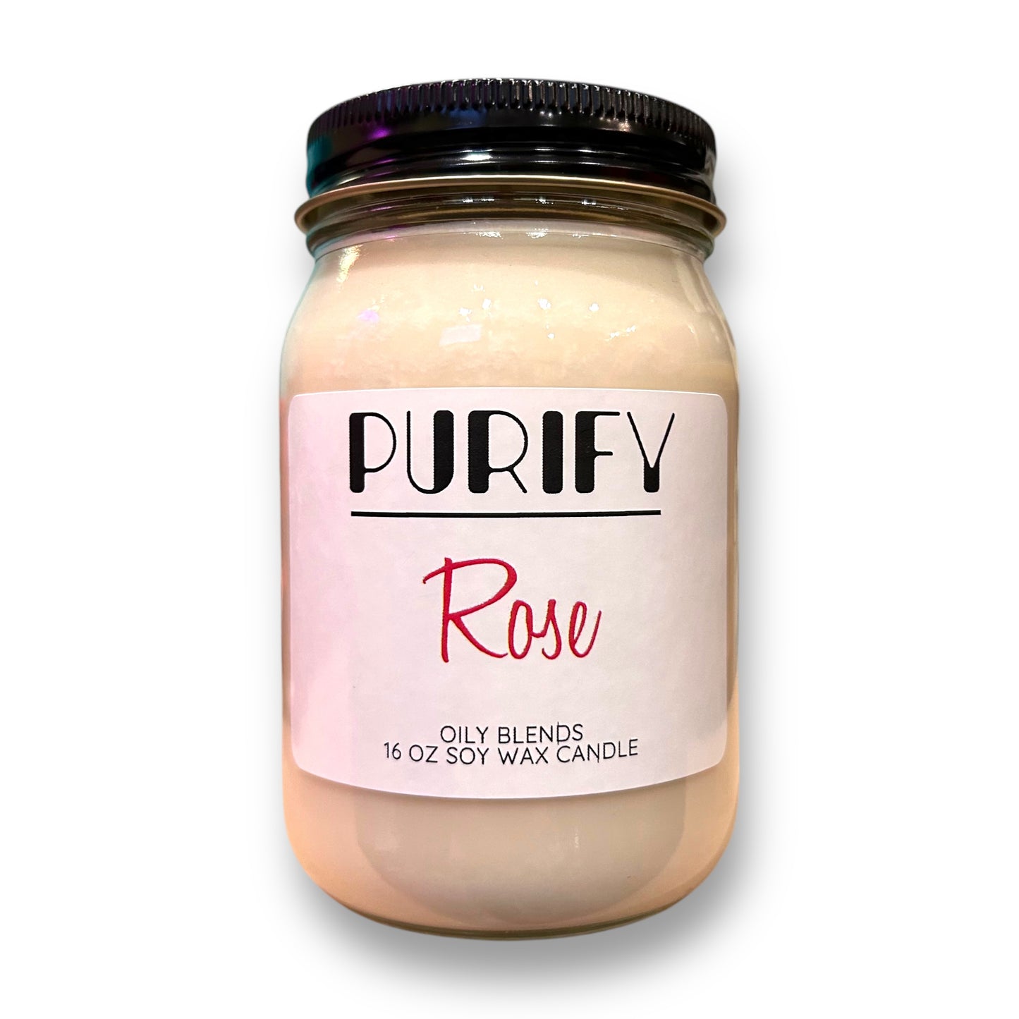 A beige jar of PURIFY Rose natural soy wax candle with herbs and pink salt, with a label that reads '16 oz. / 425g' and 'Oily Blends'.