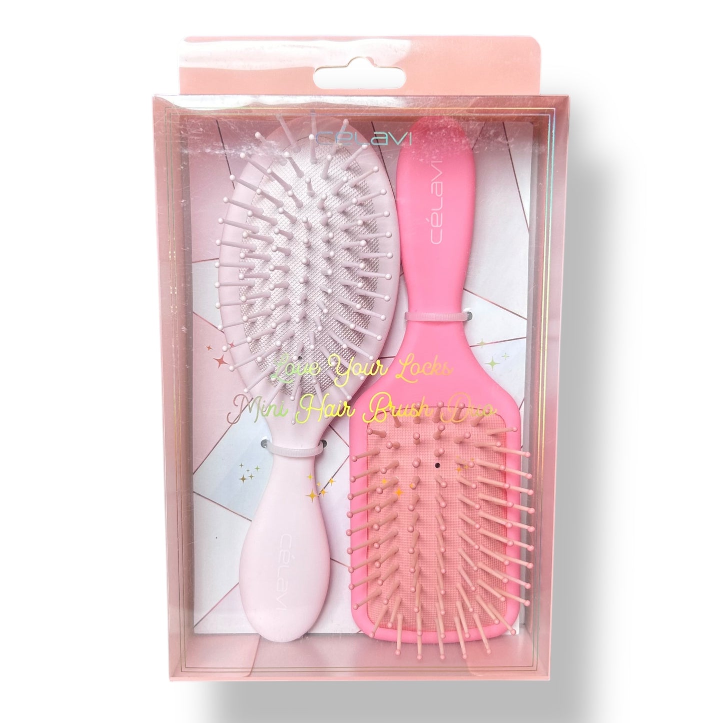 Celavi Love Your Locks Pastel Pink Mini Detangling Hair Brush Duo in packaging, showing one brush with a paddle design and another with a round brush design.