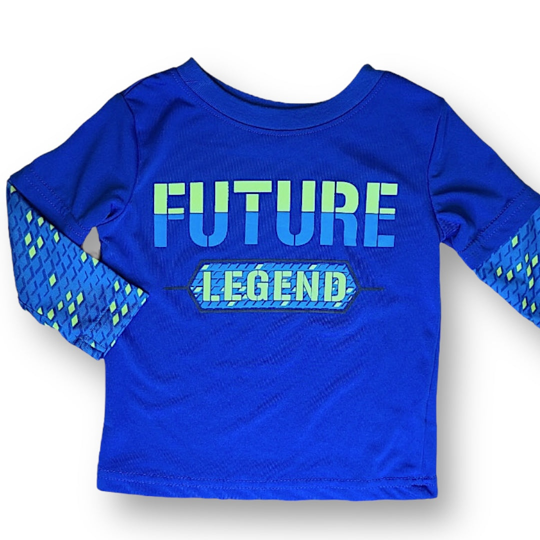 A royal blue long-sleeved athletic shirt for a 12 month old with the text 'FUTURE LEGEND' printed on the front and a patterned design on the sleeves.
