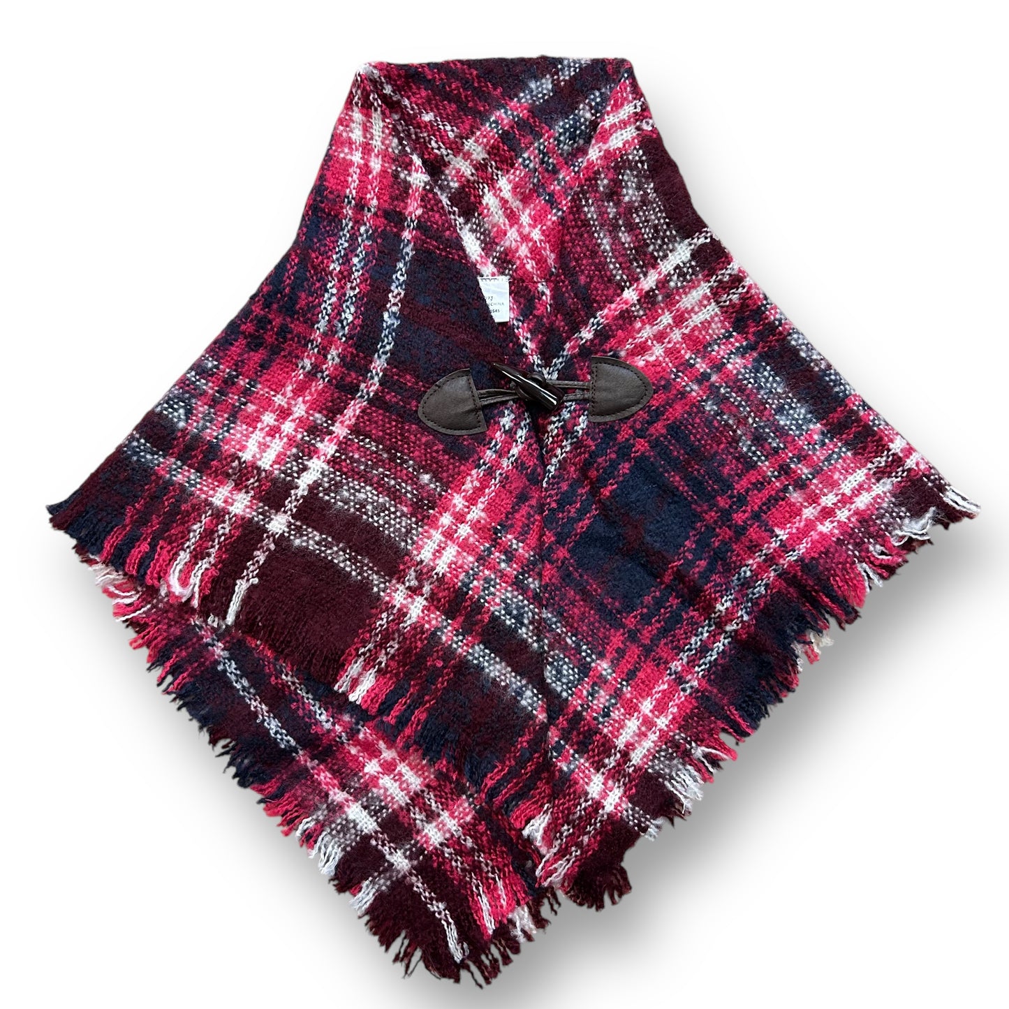 A girls size 2/3 years shawl with pink and navy plaid pattern and a button close at the top.