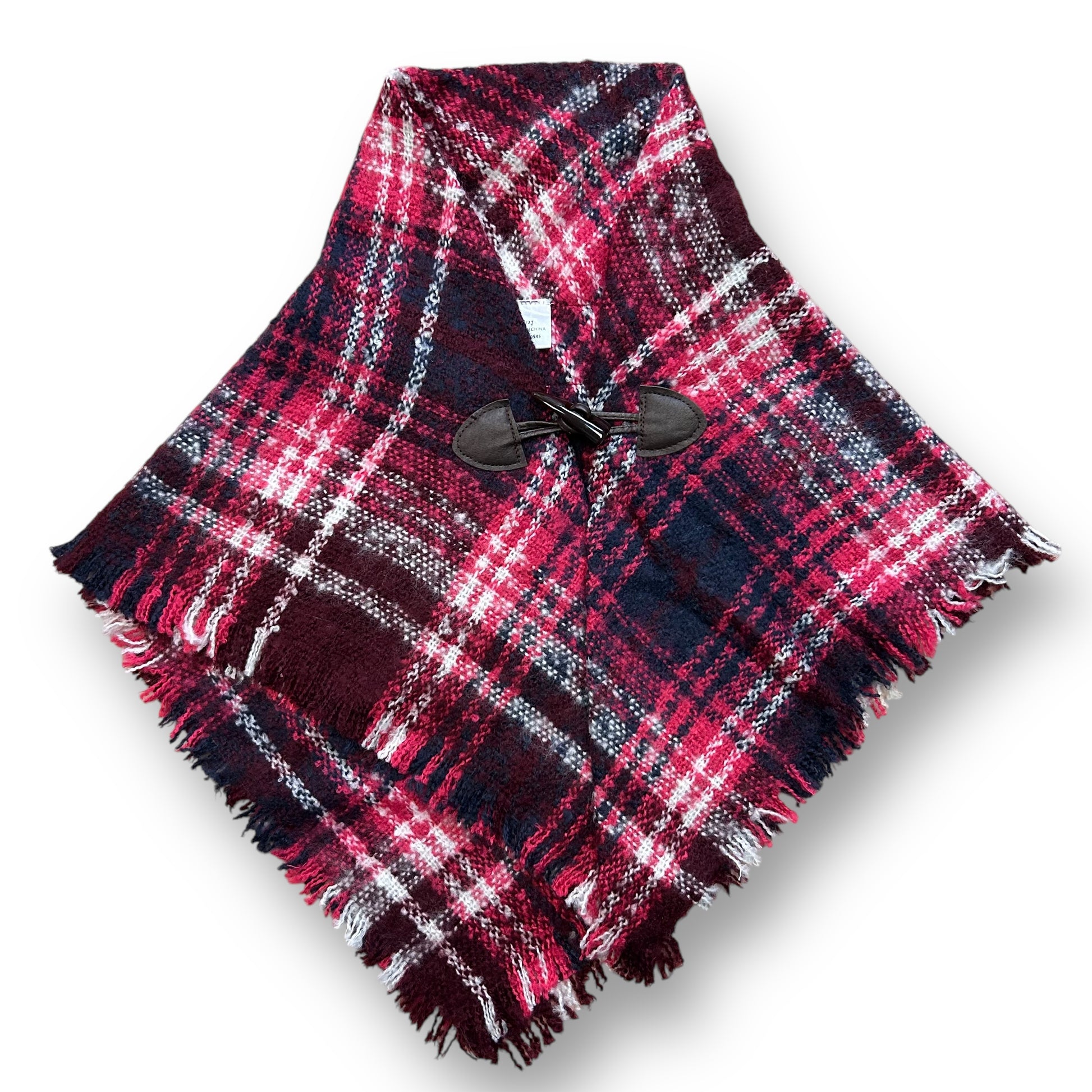 A girls size 2/3 years shawl with pink and navy plaid pattern and a button close at the top.