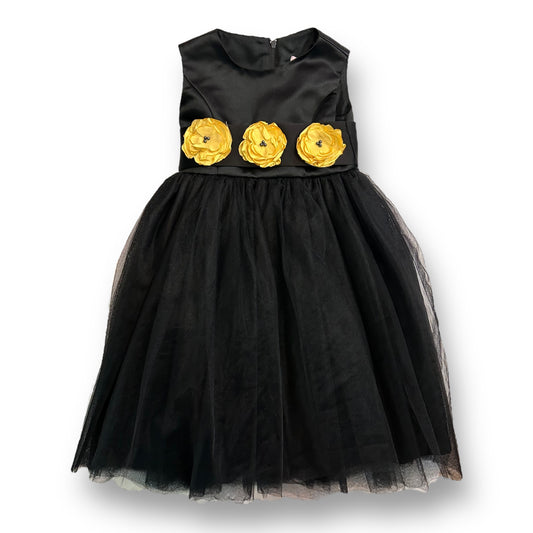 A black sleeveless tulle bottom formal dress with yellow flower embellishments on the waistline for girls.