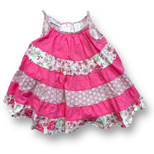A pink and white floral spaghetti strap twirl dress for girls aged 6-9 months.