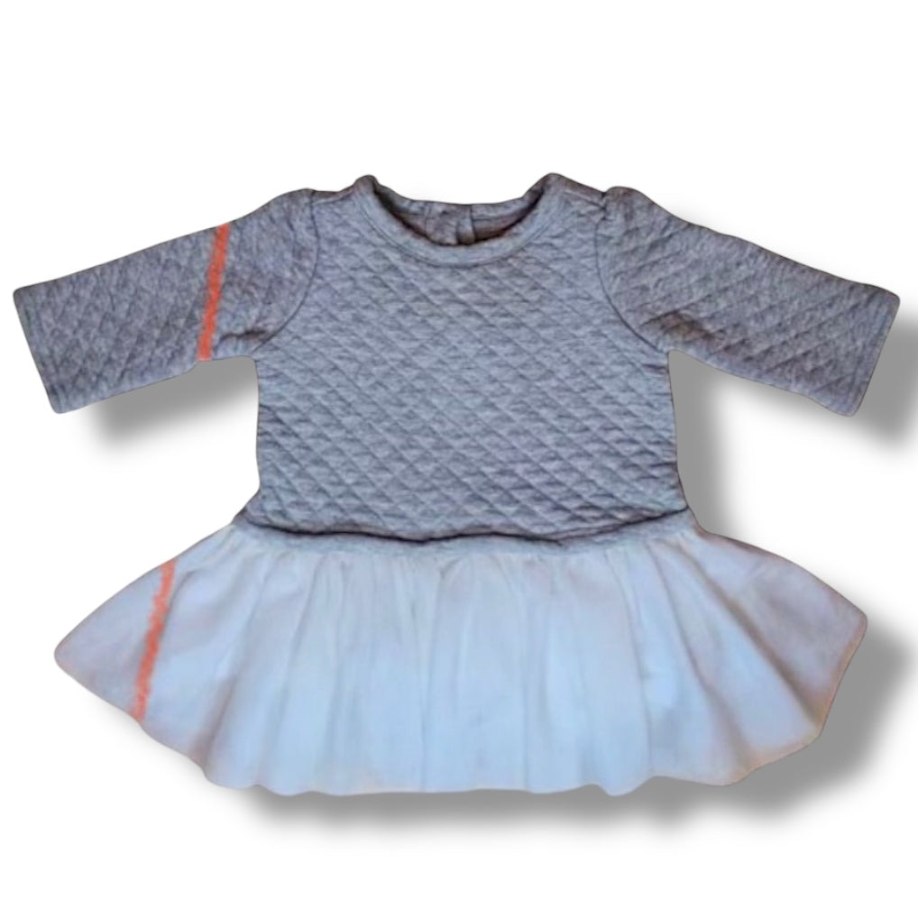 Children's dress with quilted gray top and light blue skirt on a white background