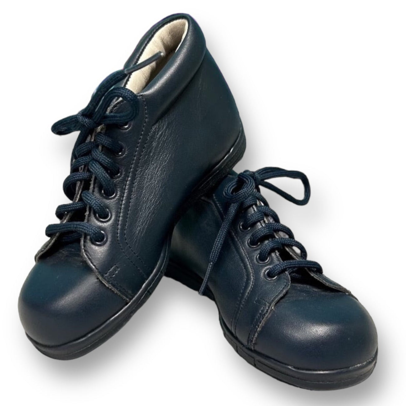 A pair of navy blue toddler boy size 6.5 casual dress shoes with lace-up closure.