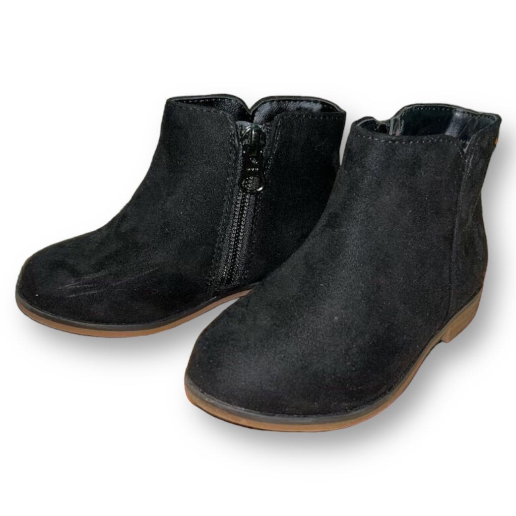 A pair of black suede toddler girl side-zip booties.