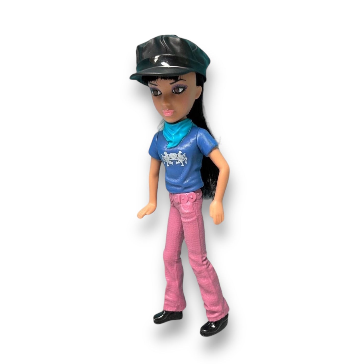 A 5-inch collectible doll with long hair, wearing a blue shirt, pink pants, and black boots, with a black cowboy hat on its head.