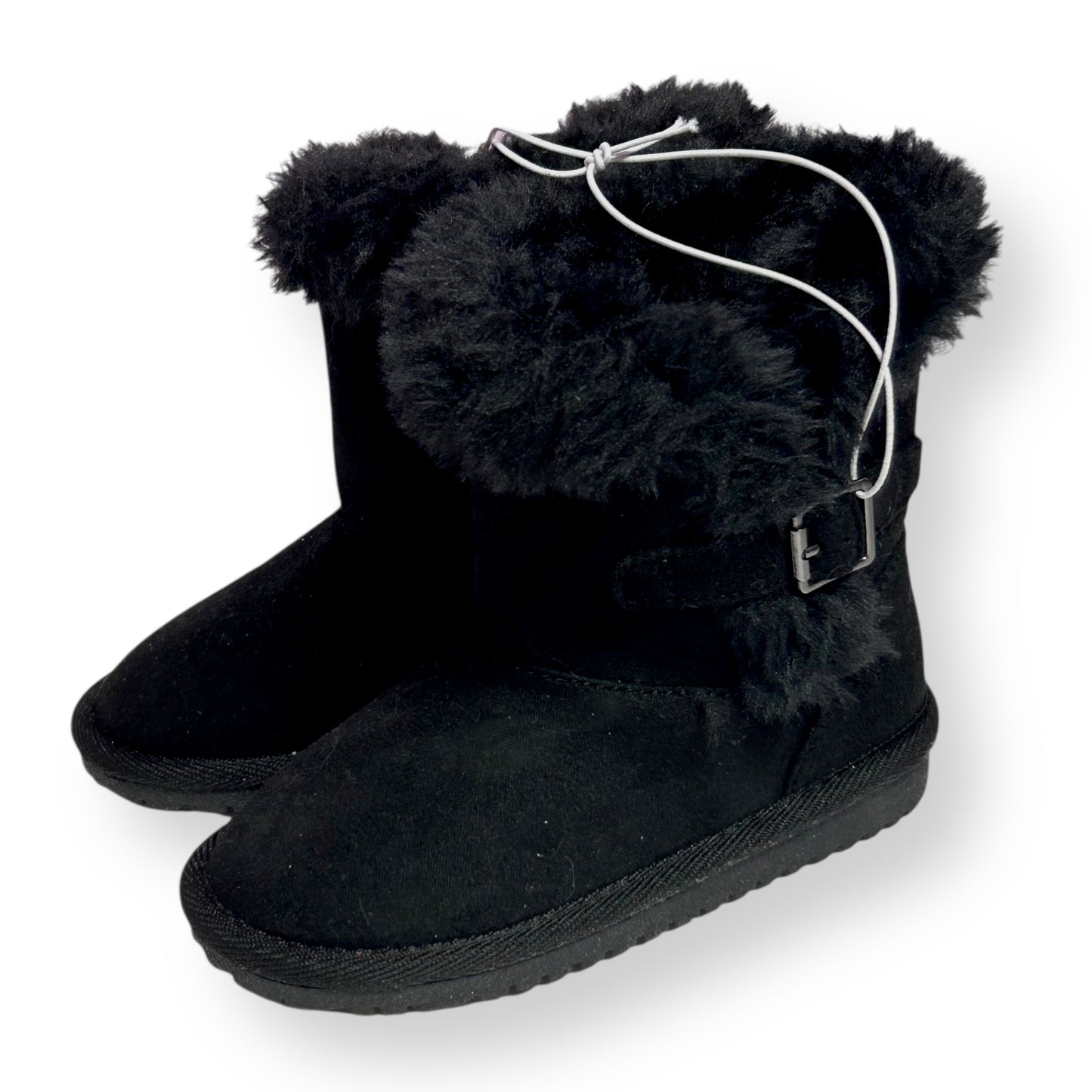 Black furry boots with a buckle on a white background