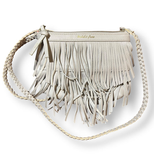 Beige fringe handbag with braided handle on a white background