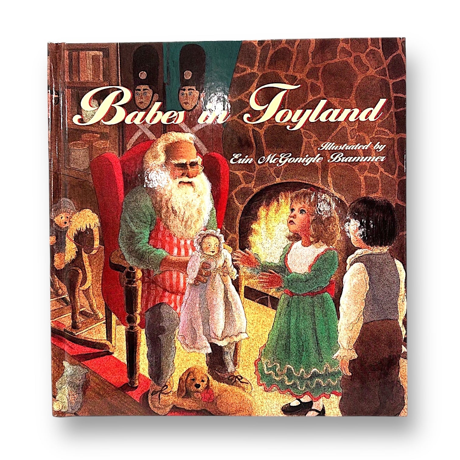 A cover illustration of the book 'Babes in Toyland' featuring Santa Claus presenting a toy to a young girl, with her parents and a dog looking on in a cozy room.
