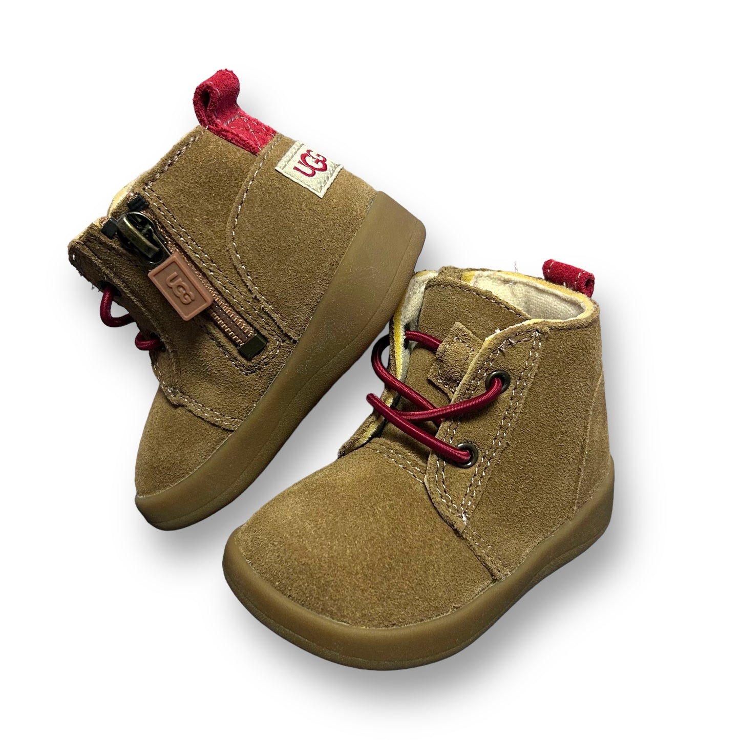 A pair of brown UGG baby boy size 2 side-zip suede leather boots with lace-up closure and a round toe style.