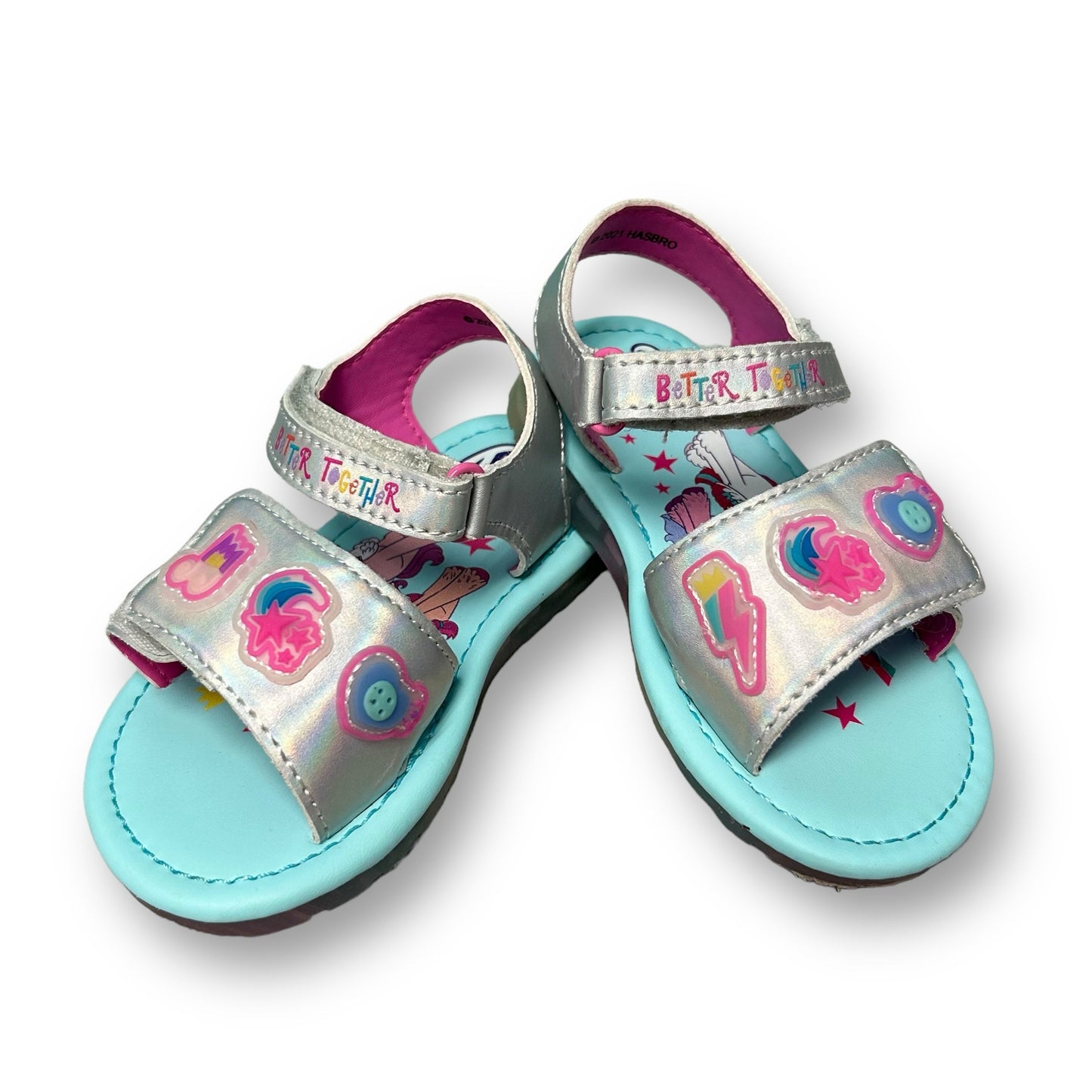 A pair of blue metallic light-up sandals with My Little Pony character decorations.