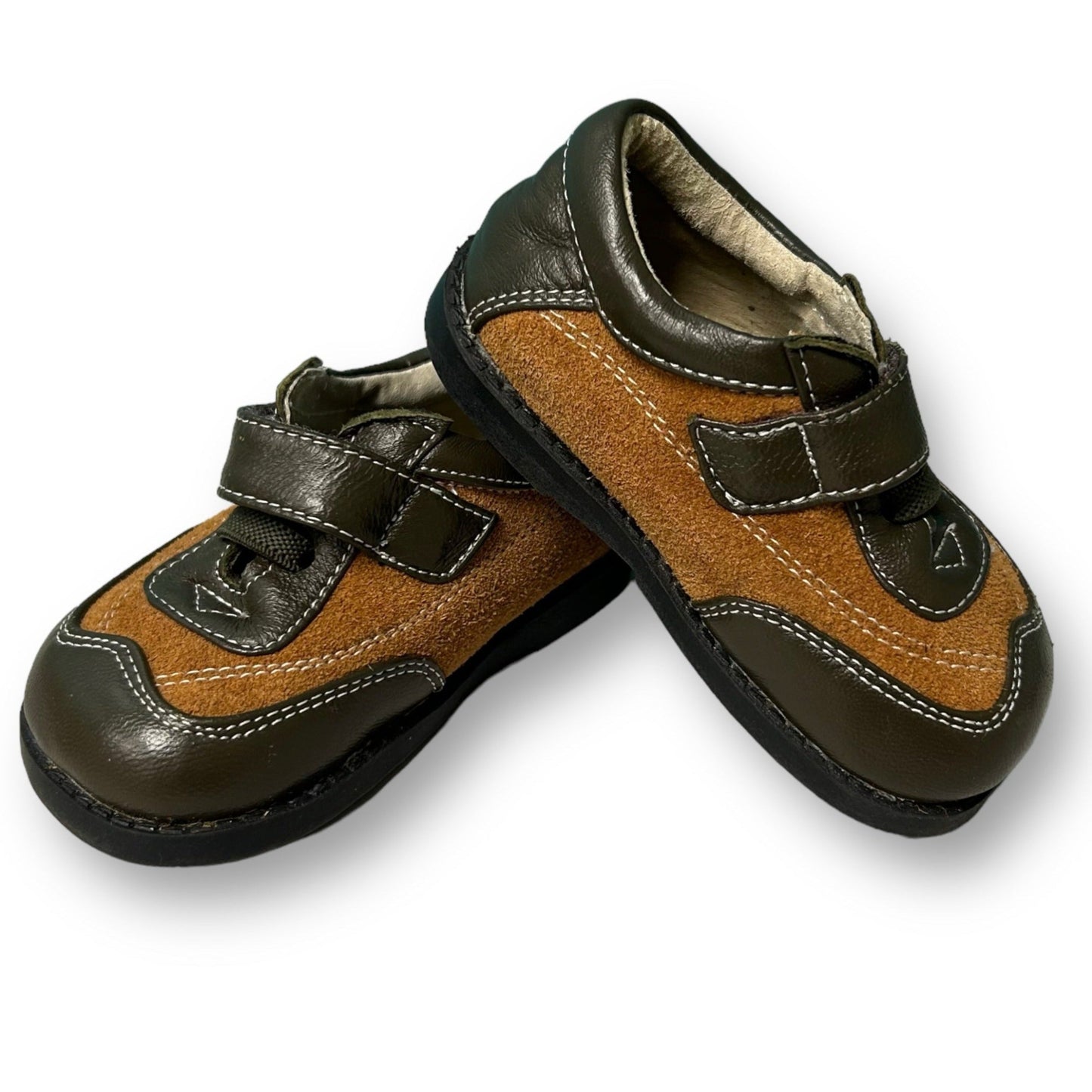 A pair of brown leather See Kai Run toddler boy easy-on shoes with a slip-on design.