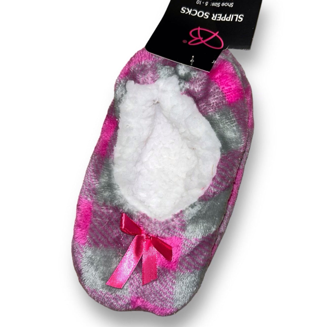 A pair of pink and gray checkered plush slippers for toddler girls, displayed in packaging.