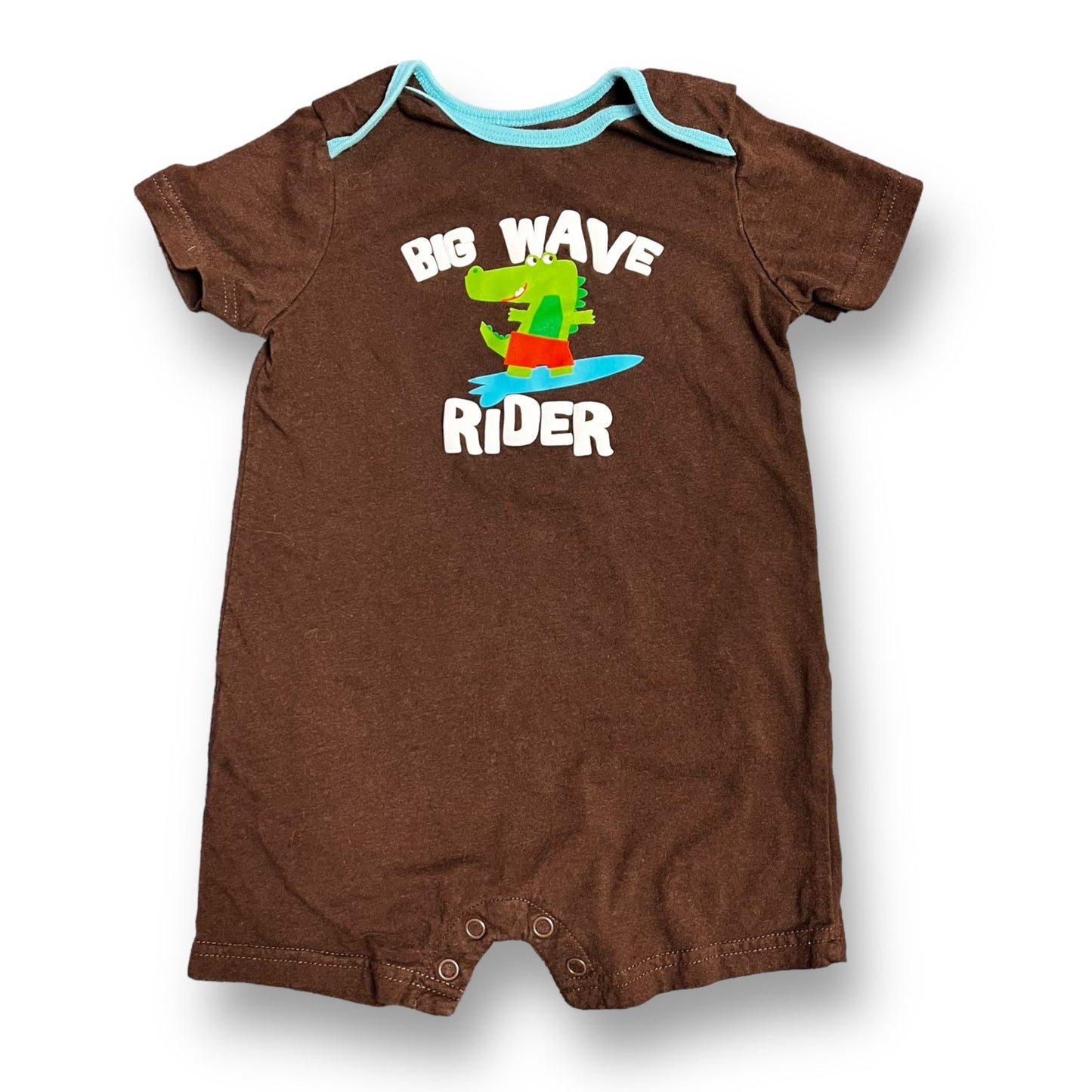 A brown snap bottom romper for a 24-month-old boy with an alligator graphic and the text 'Big Wave Rider' on the front.