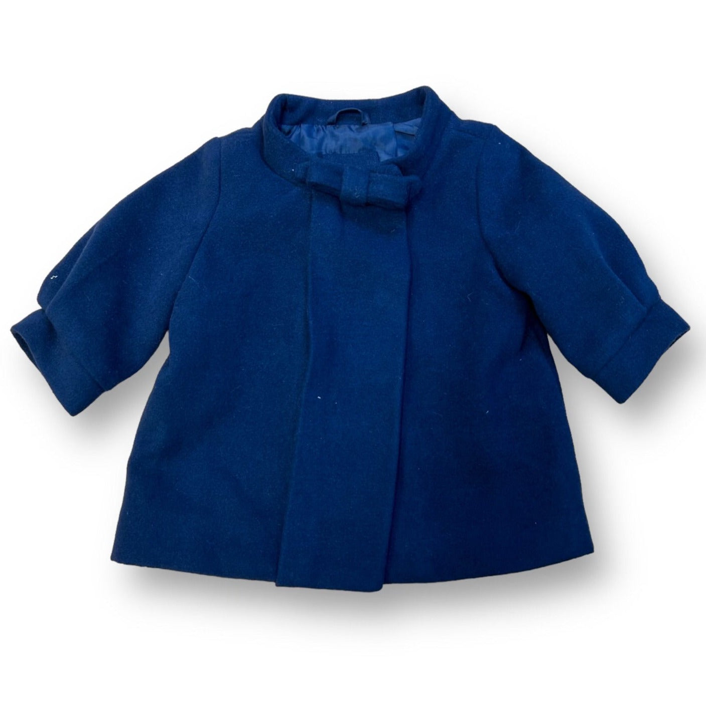 Navy blue girls' coat with a round neckline and long sleeves, designed for 3-6 month olds.