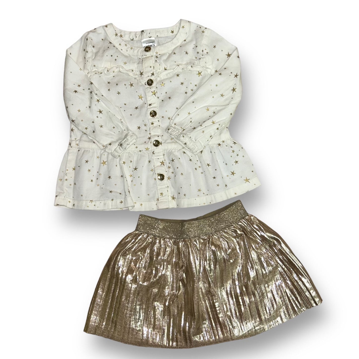 A baby girl's outfit consisting of a white ivory button down top with metallic gold accents and a metallic gold skirt.