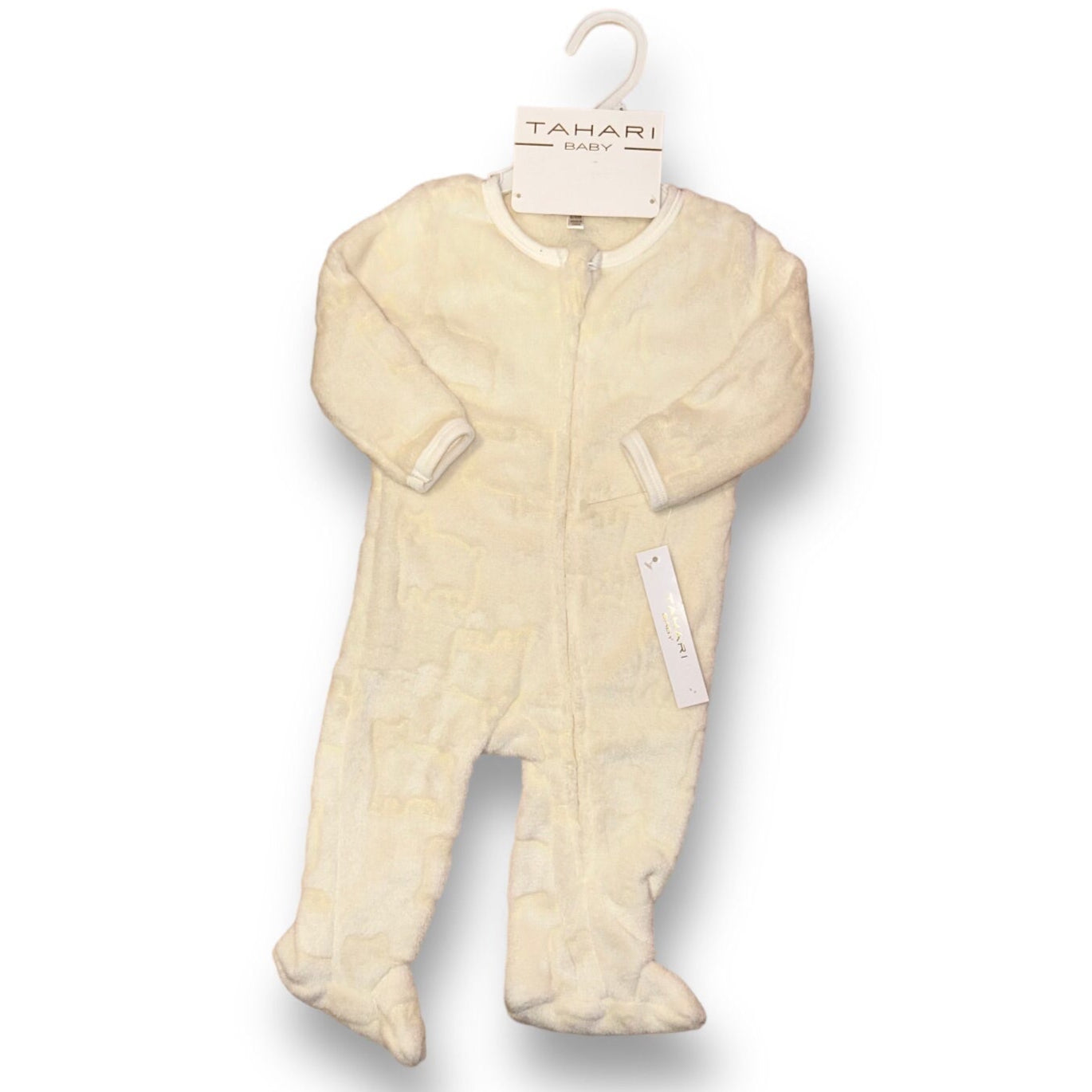 A buttercream brown Tahari branded baby one-piece with a fur footie.