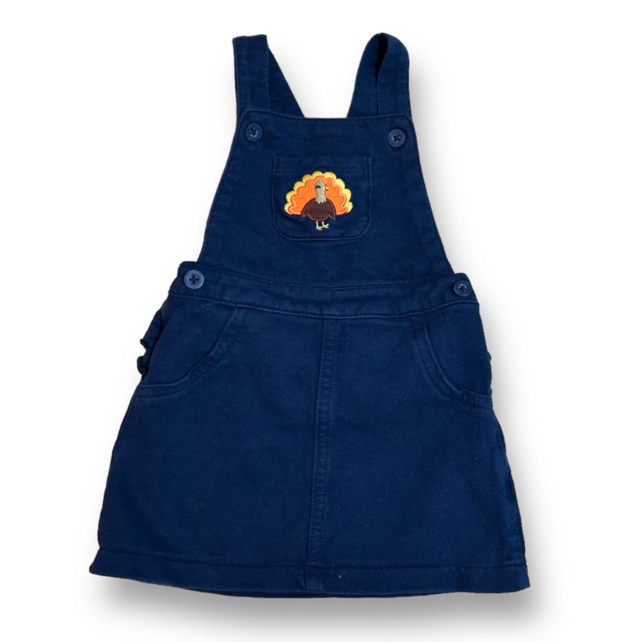 A navy blue jumper for girls with embroidered Thanksgiving turkey design, featuring short sleeves and a button-up front.