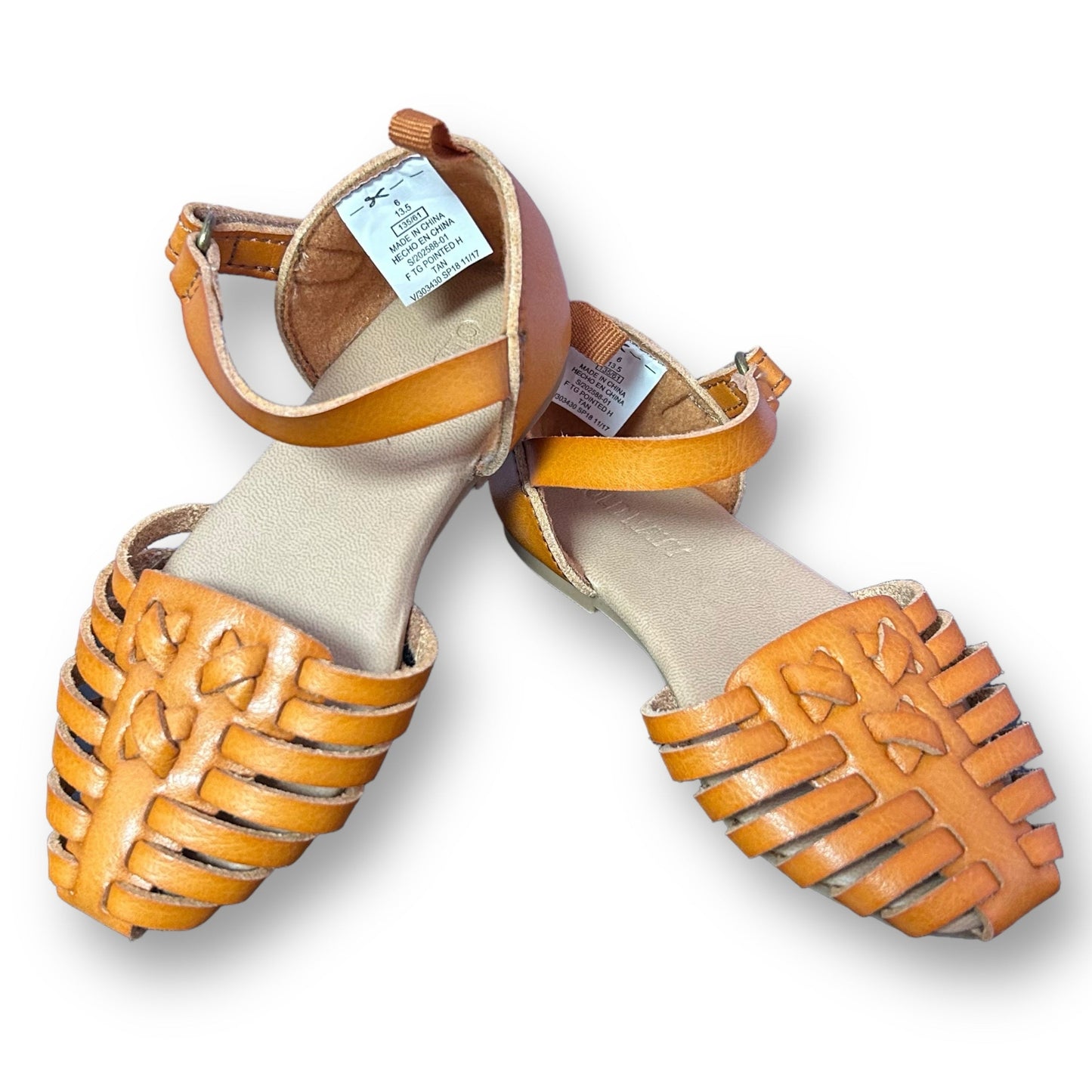 A pair of tan faux leather easy-on sandals for toddler girls, displayed against a white background.