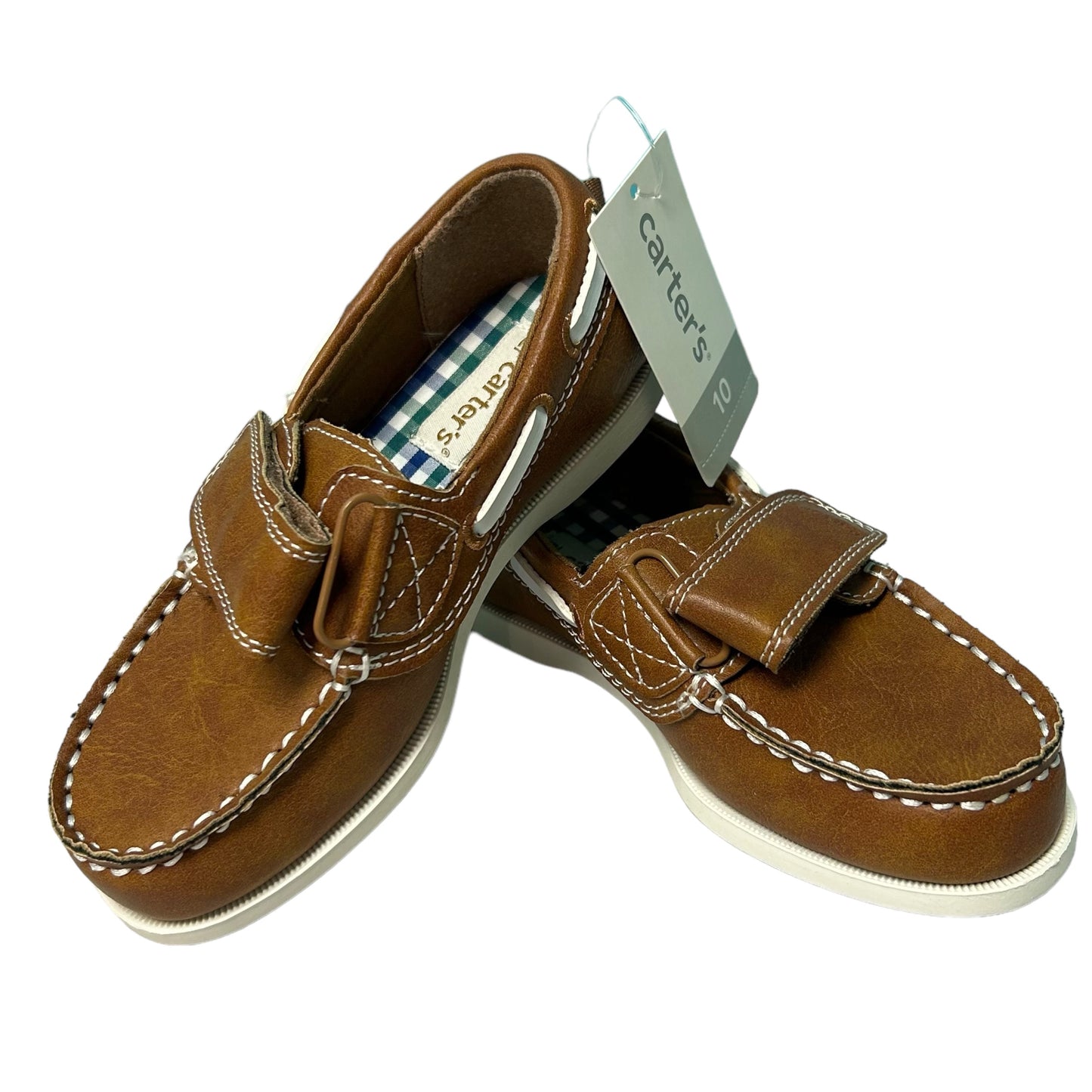 A pair of brown leather boat shoes with the tags 'Carter's' and 'Big Boy' visible on the upper part.