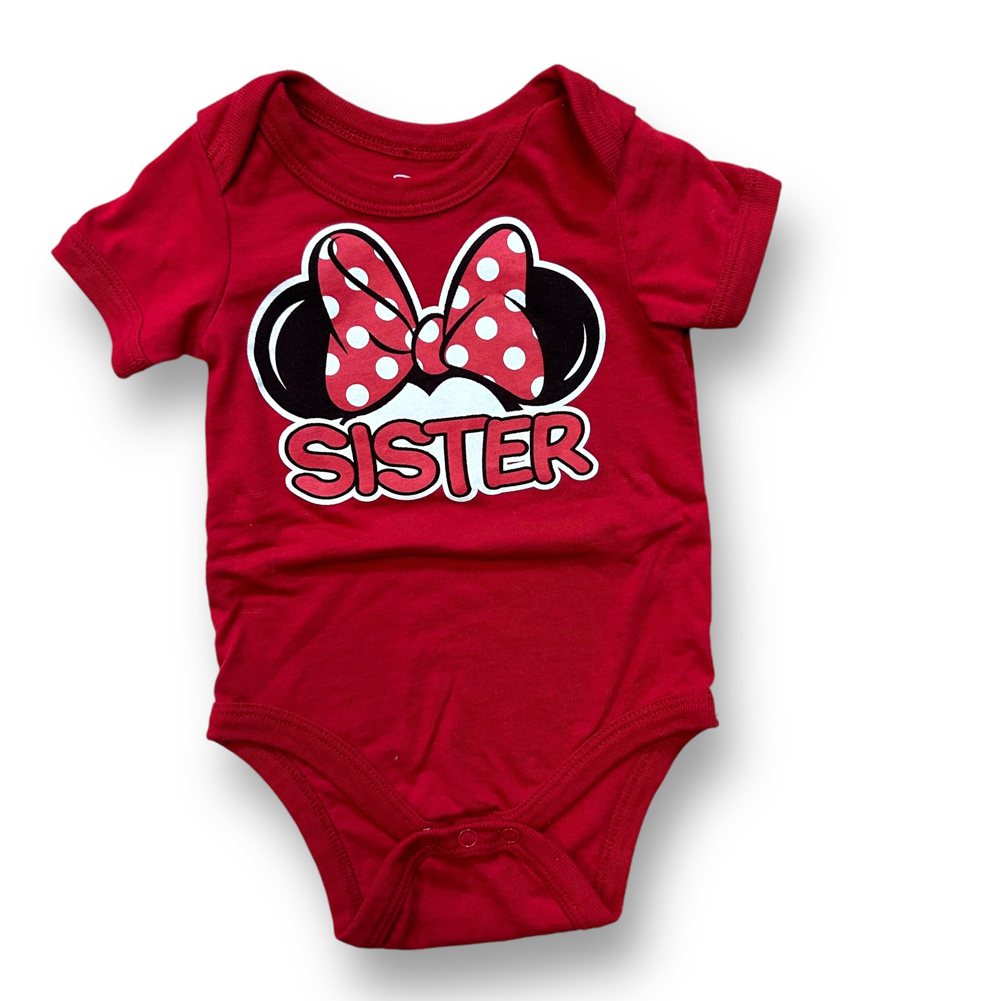 A red bodysuit for a 12-month-old girl with a Minnie Mouse design, featuring a bow and the text 'Sister' on the front.