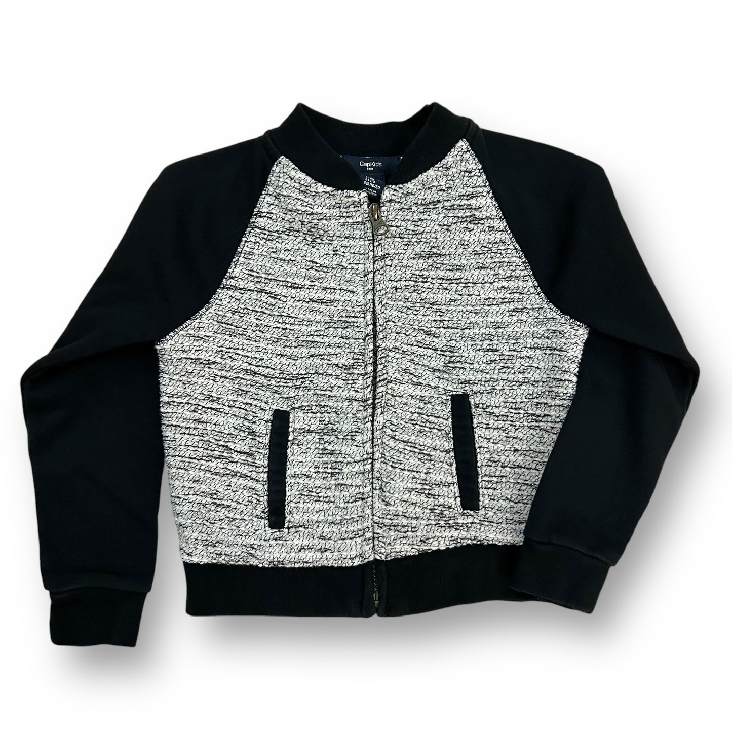A girls' Gap jacket in black and white with a zippered front and a round neckline.