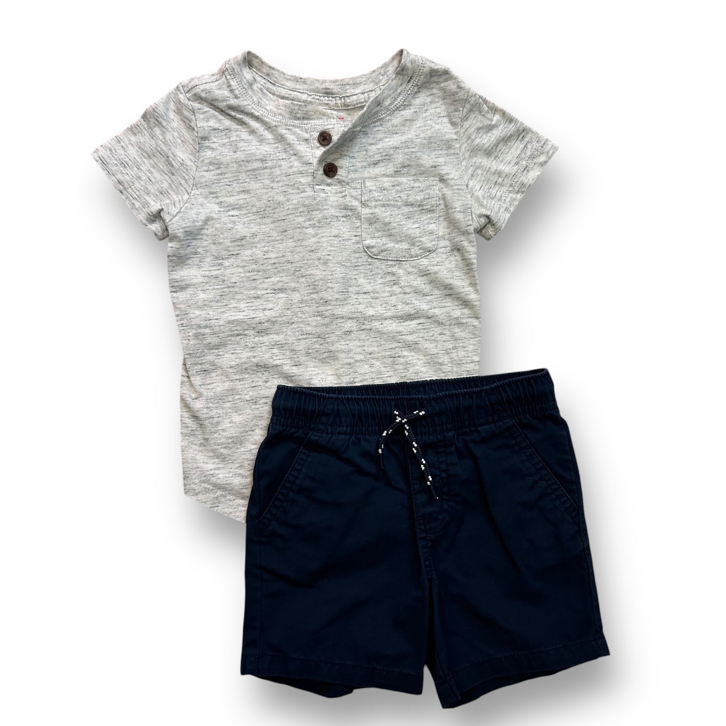 A navy blue pair of shorts and a gray henley shirt for a toddler.