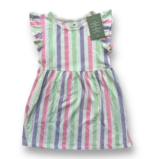 A girls' H&M striped cotton blend dress in pastel colors with a ruffled hemline.