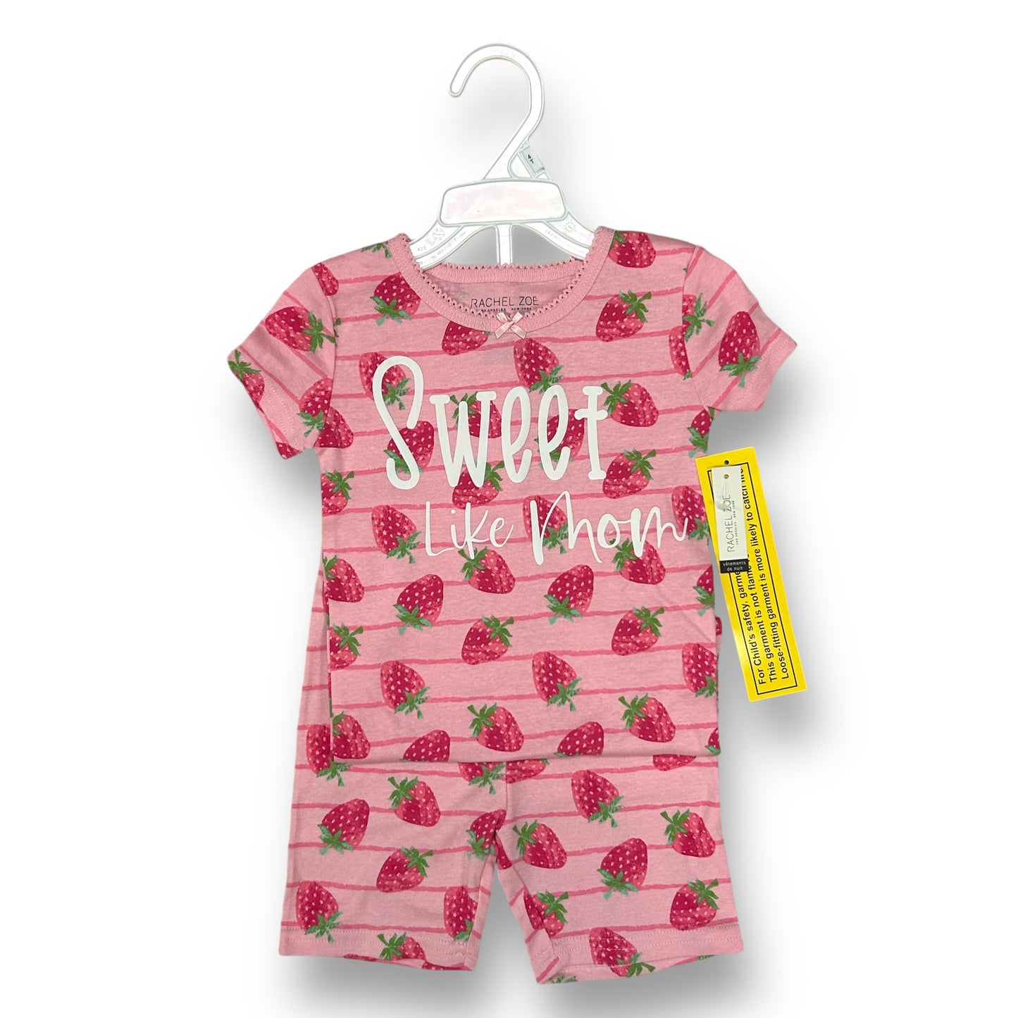 A pink sleeveless top with strawberry print and the text 'SWEET like them' on it, displayed on a hanger with a label.