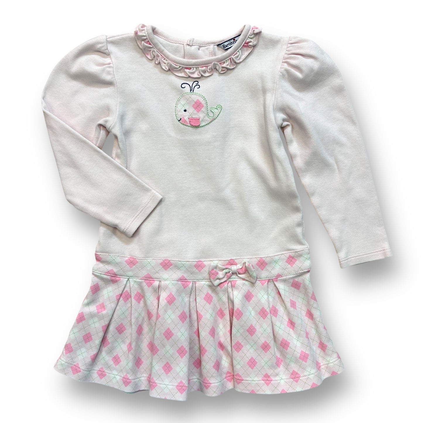 A pale pink long sleeve dress with a whale design on the sleeve, and a green and white checkered pattern on the skirt, for a 24 month old girl.
