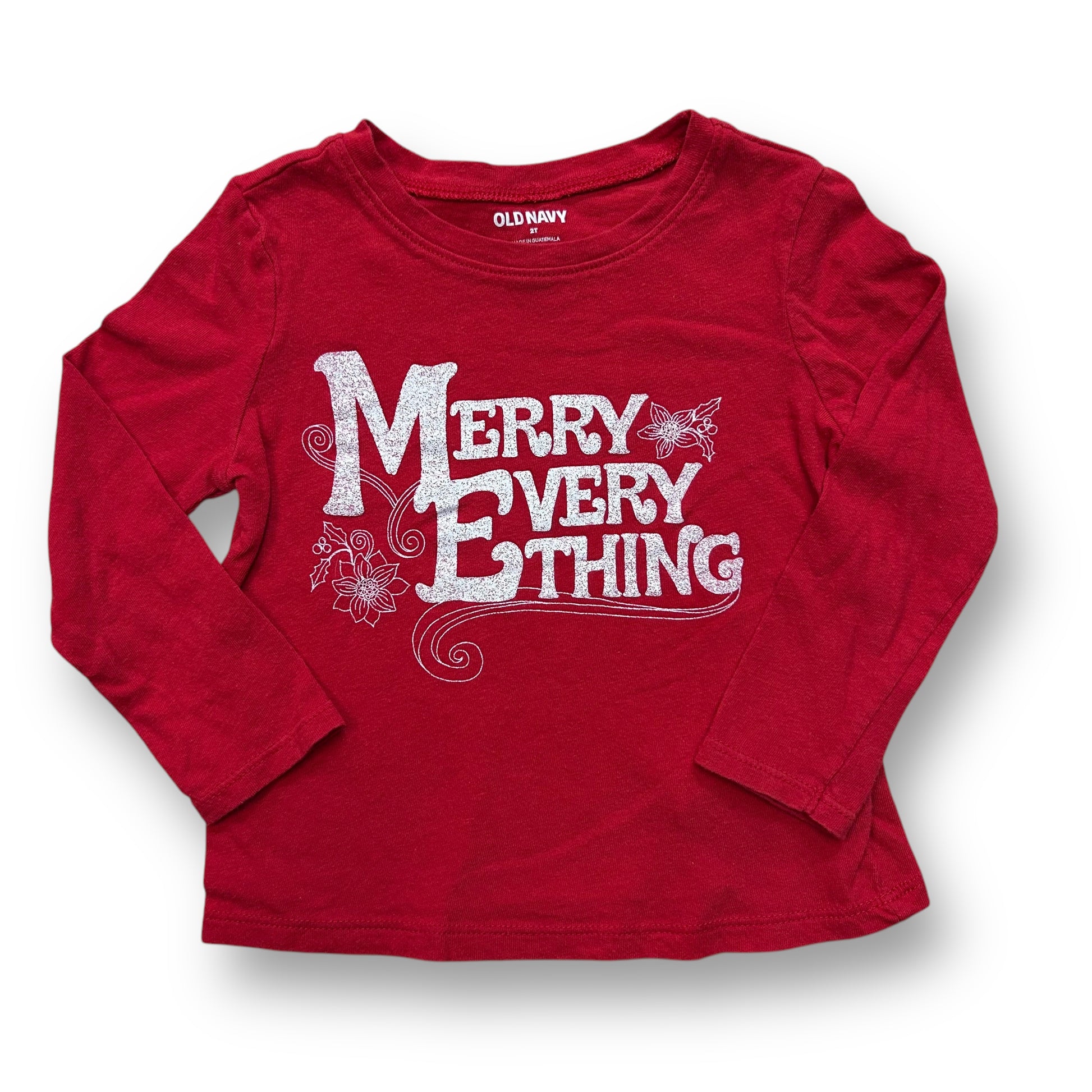 A red long sleeve boys' t-shirt with the text 'Merry Everything' printed on the front.