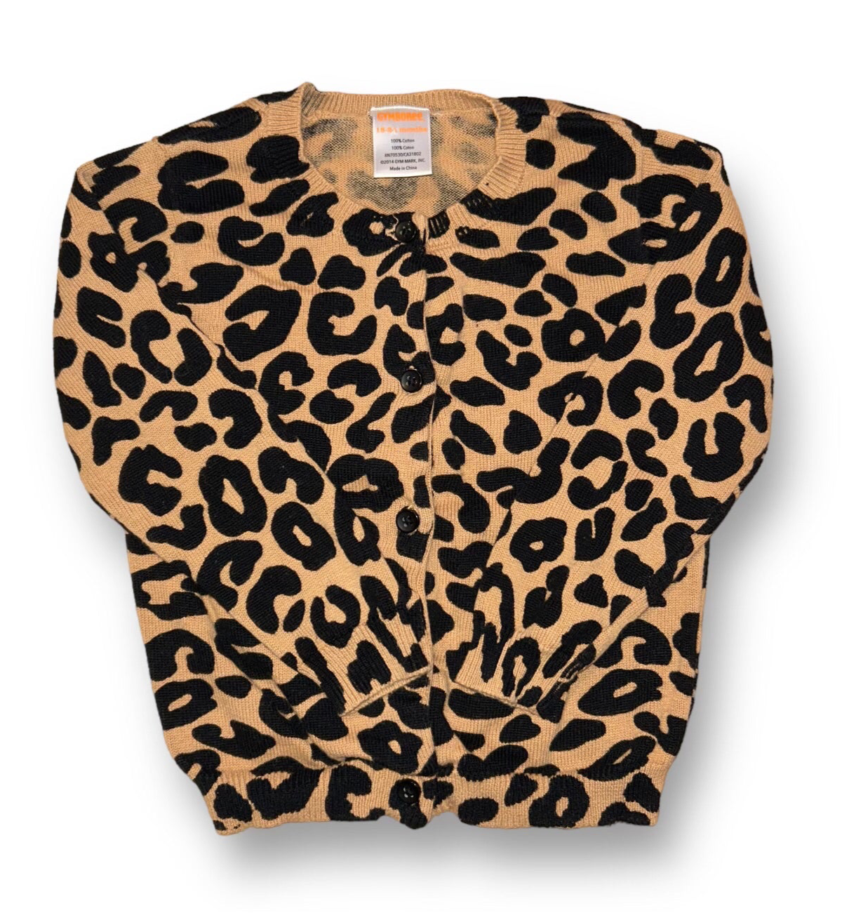 Leopard print sweater on a white background