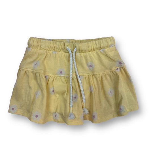 A yellow floral print drawstring skort for girls.