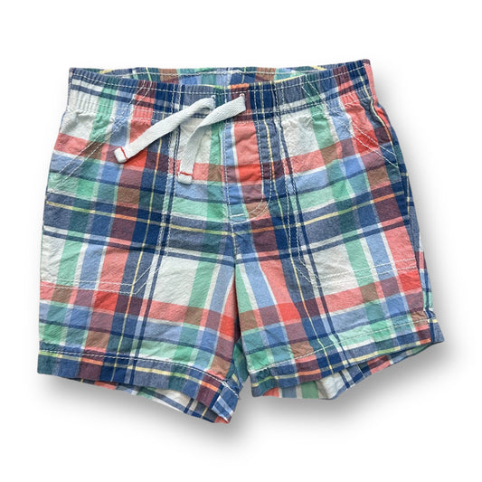 A pair of boys' pull-on shorts with a pastel plaid pattern in red, blue, green, and beige colors.