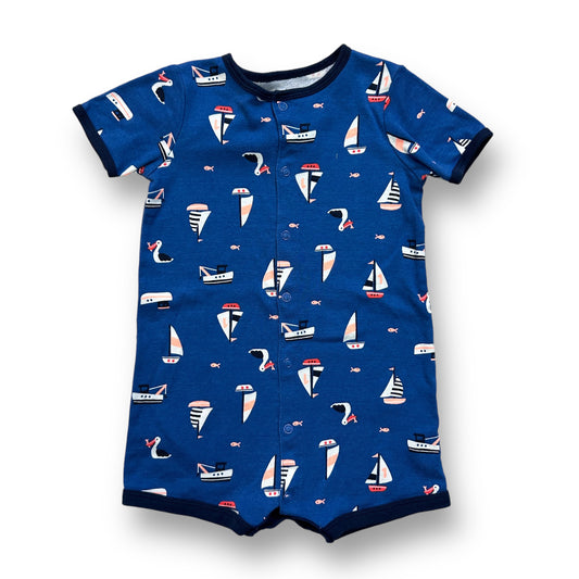 Toddler size blue one-piece with a sailboat print and snap bottom.