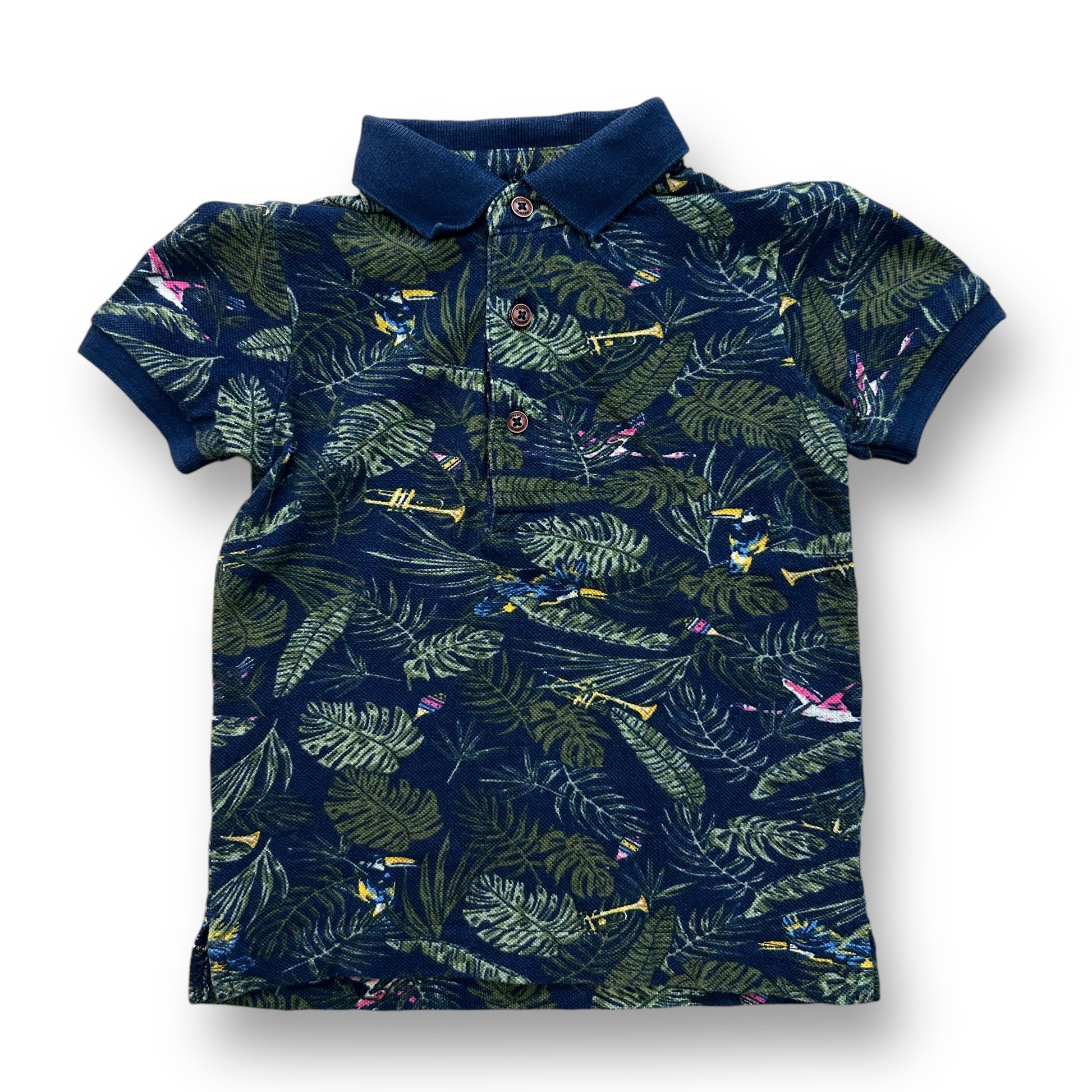 A navy-colored polo shirt with a tropical print, featuring short sleeves and a collar.