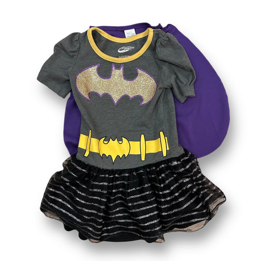 A 2T girls' dress and cape set featuring a gray shirt with a yellow belt and a purple cape with a Batgirl design.