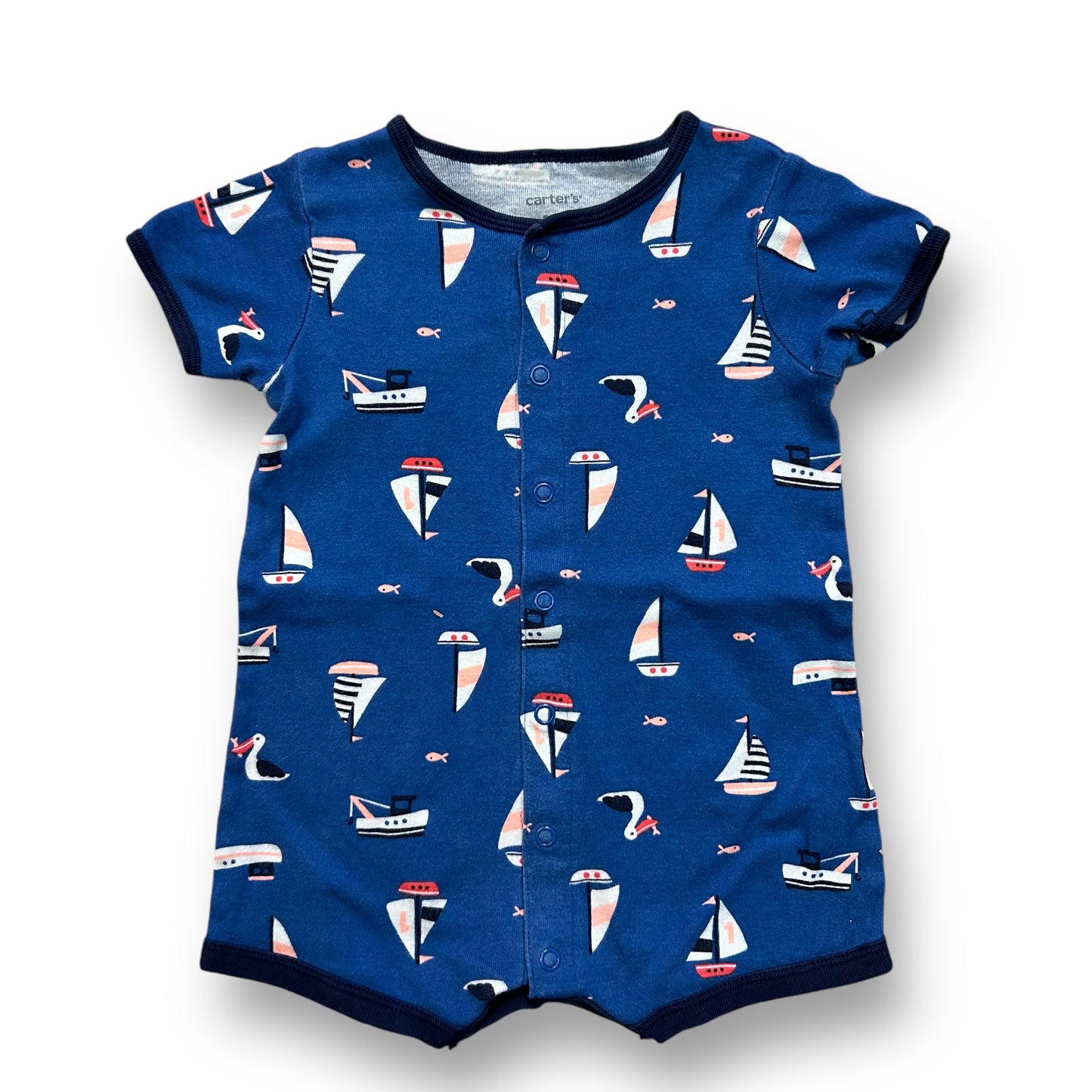 A blue and white sailboat-themed one-piece short sleeve snap leg garment for a baby boy.