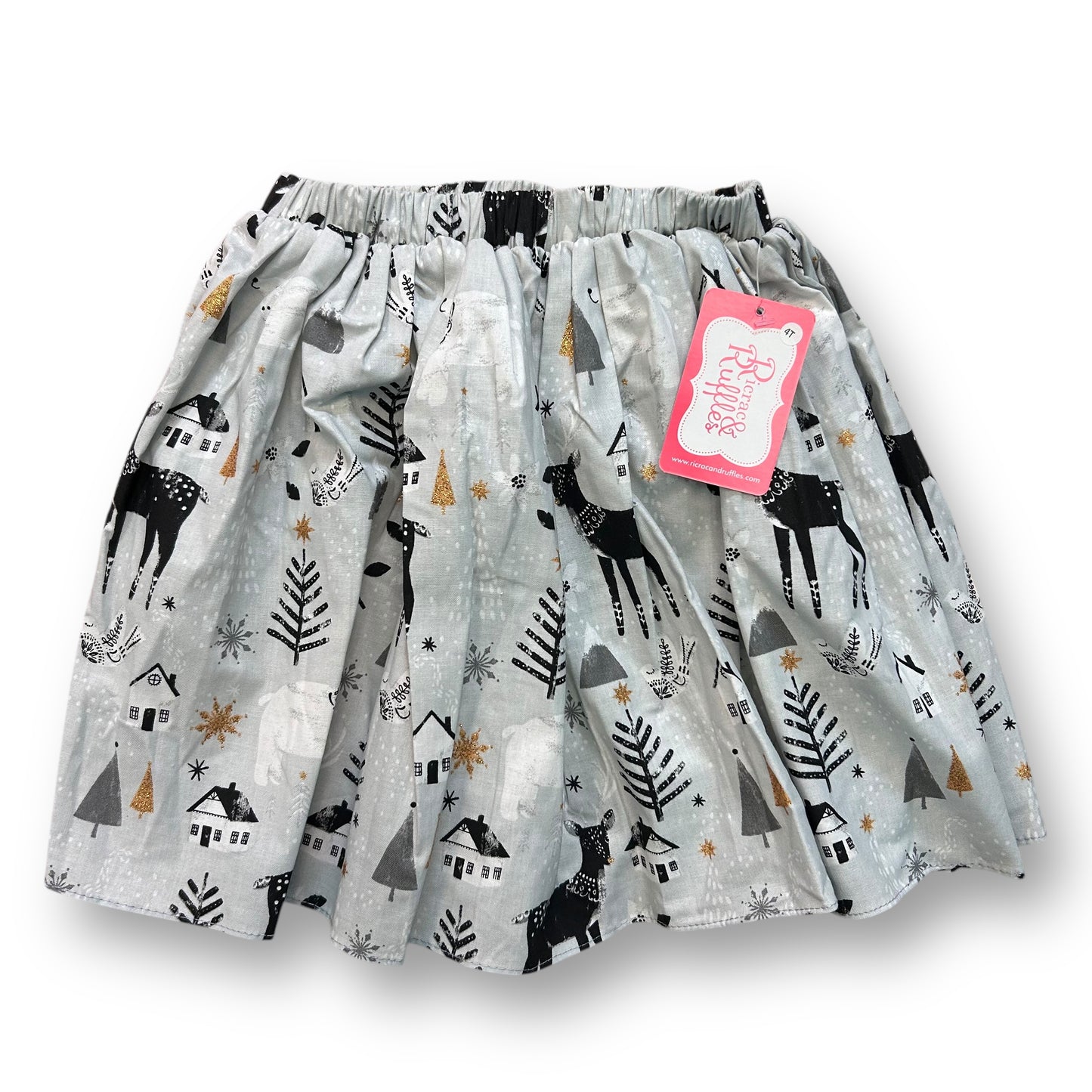 A gray Christmas-themed boutique skirt for girls with ricrac and ruffles, featuring reindeer and holiday motifs.